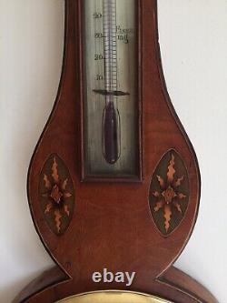 Antique barometer and thermometer wall mounted