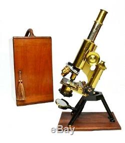 Antique lacquered brass compound microscope by James Swift of London, circa 1910