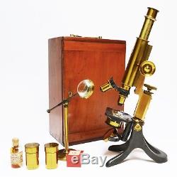 Antique lacquered brass compound microscope by Pickard Curry & Co of London