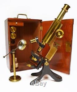 Antique lacquered brass compound microscope by Pickard Curry & Co of London