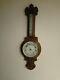 Antique large oak ornate aneroid barometer with thermometer