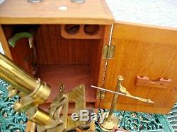 Antique late Victorian lacquered brass compound monocular cased microscope