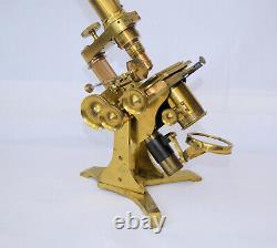 Binocular microscope with accessories in case J. H. Steward, 406 Strand