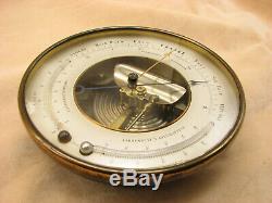 E. G. Wood Holosteric brass cased barometer with twin thermometers circa 1870