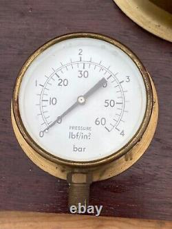 Retro display five vintage pressure gauges mounted on a board steam punk